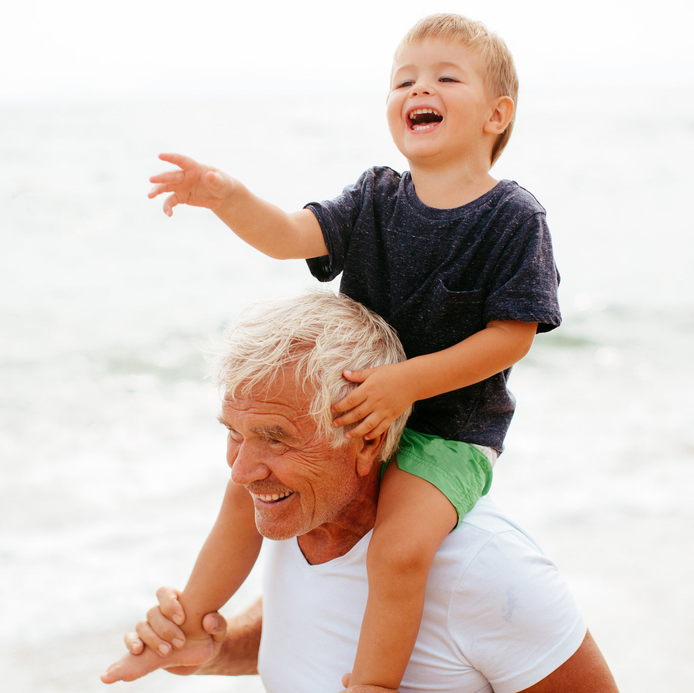Active senior playing with grandson will benefit with grab bars in the home to keep him safe as he ages in place